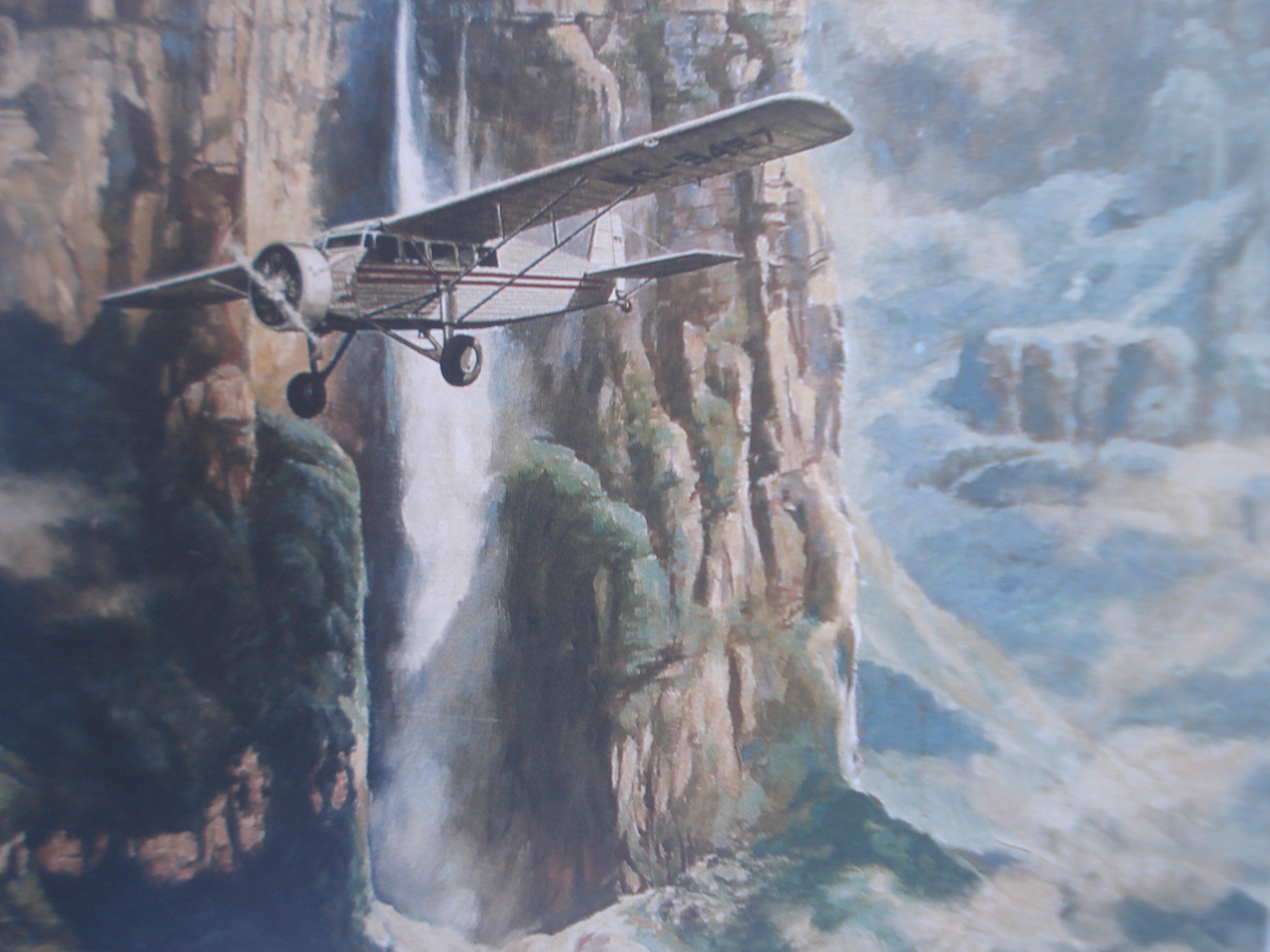 El avión “Flamingo Río Caroní” sobrevuela el imponente Salto Ángel. Ilustración de John Artal creada para la portada del libro “El Ángel de Jimmie”.